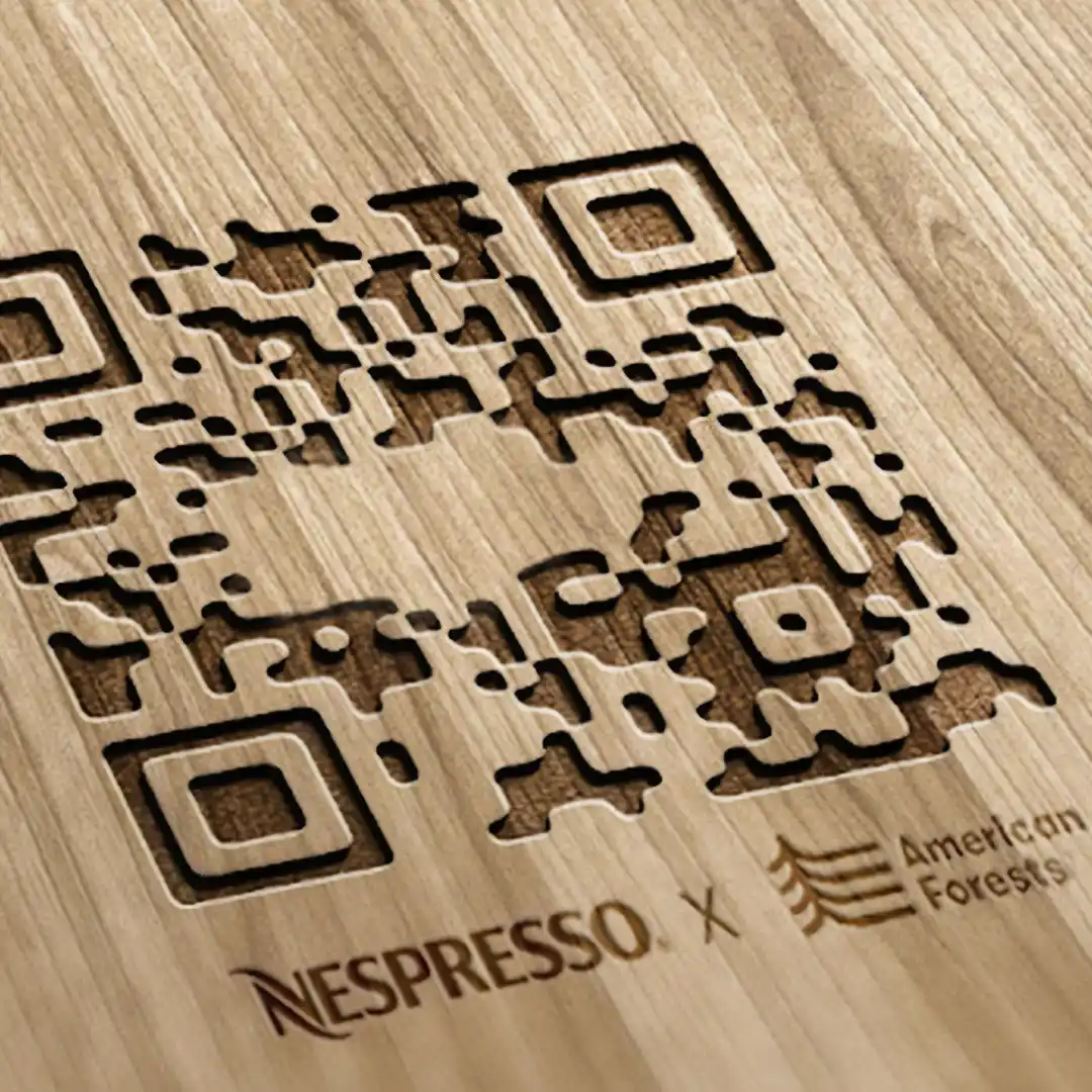 Laser-cut wooden QR code branded Nespresso x American Forests
