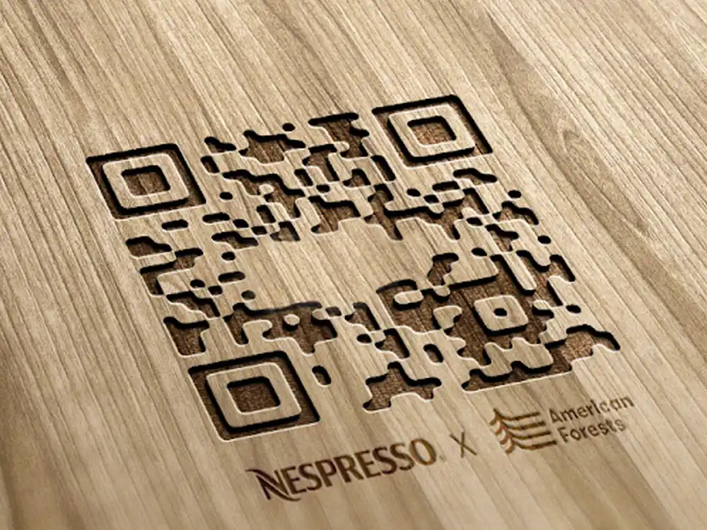 Laser-cut wooden QR code branded Nespresso x American Forests, from Innovation You Can Taste